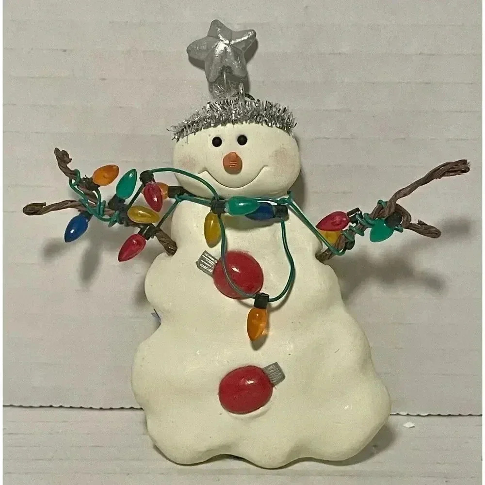 Flat Snowman With Stick Hands Holding String Of Christmas Lights Ornament  4.25”